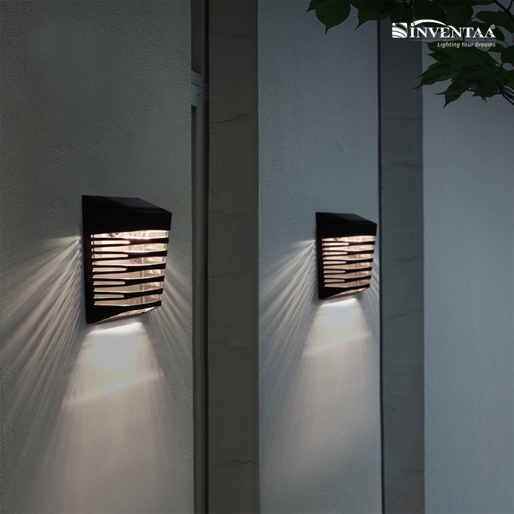 Inventaa outdoor wall lights on a white wall with a dark background