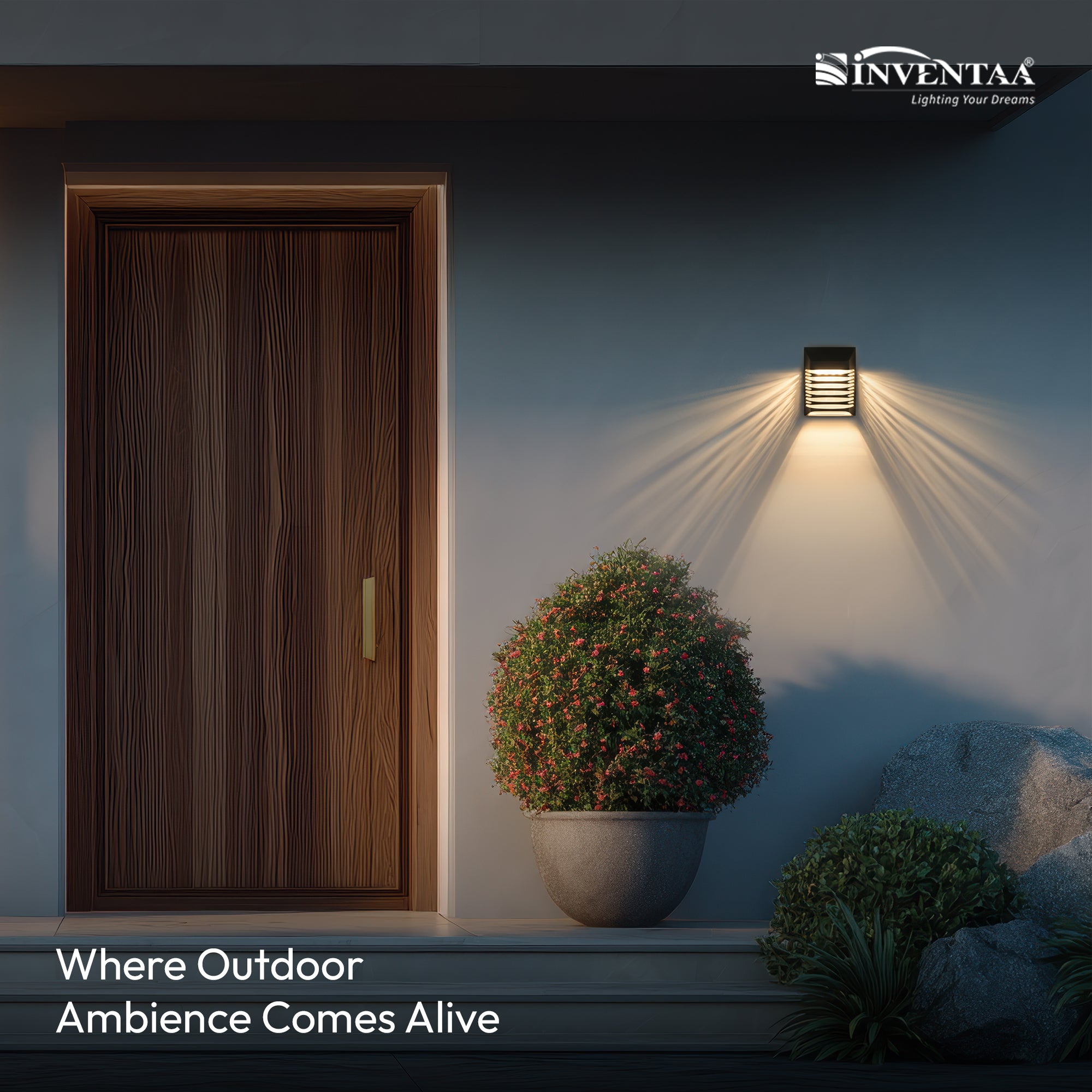 Inventaa outdoor wall light fixture illuminating a door and plants at night.