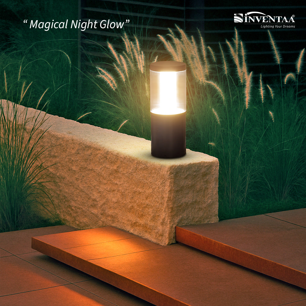 Decorative outdoor gate lamp on stone wall