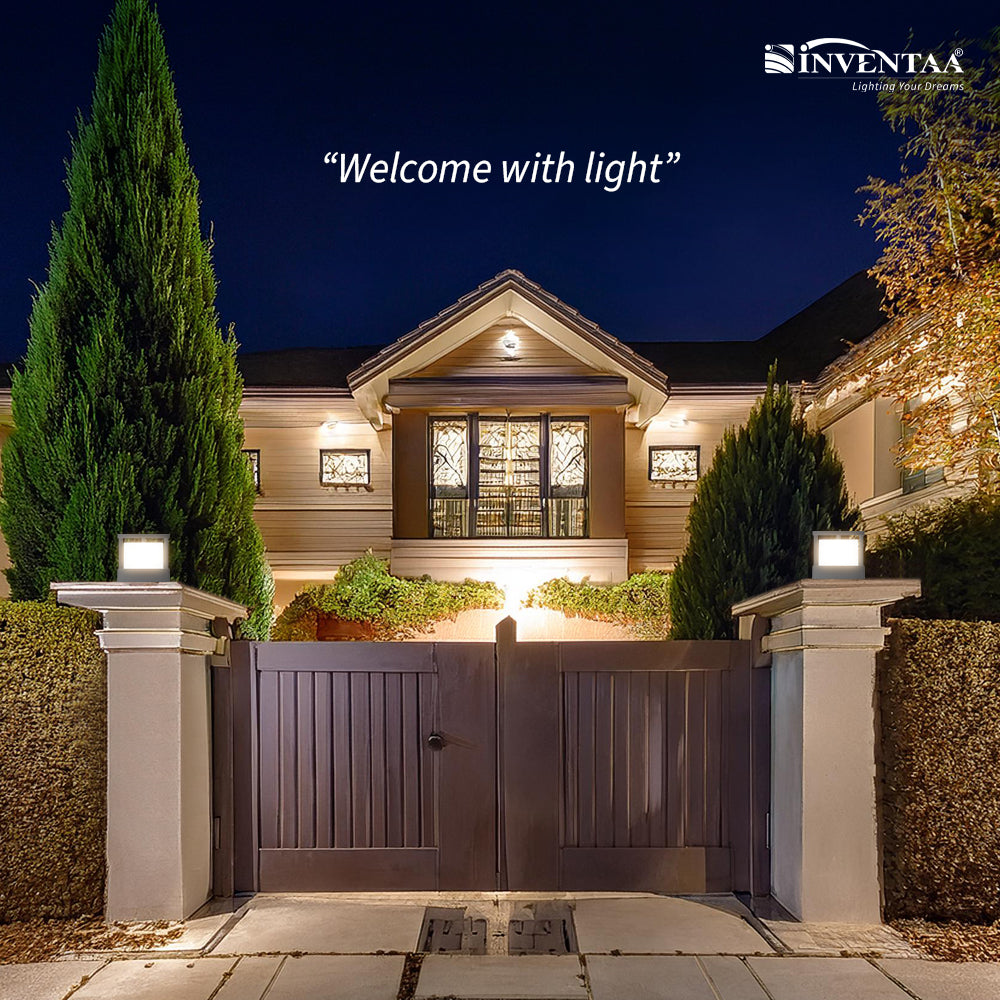 Elegant entrance light for home on gate pillars welcoming guests at night